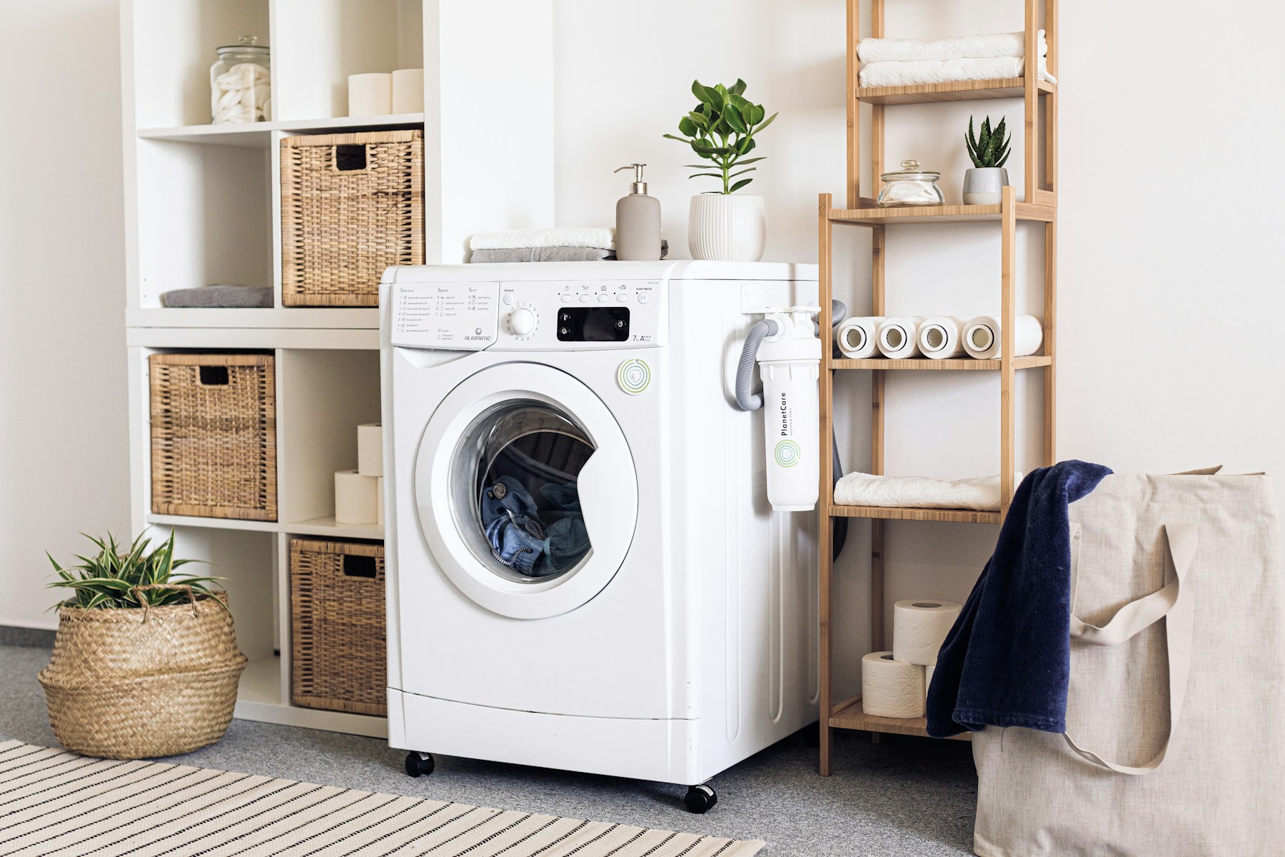 Front-load washing machine, used for the enzyme wash stage of a sweat-odour reset.